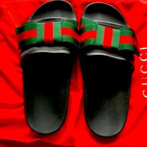 Gucci sandals. Black upper leather and red and green bow on the top